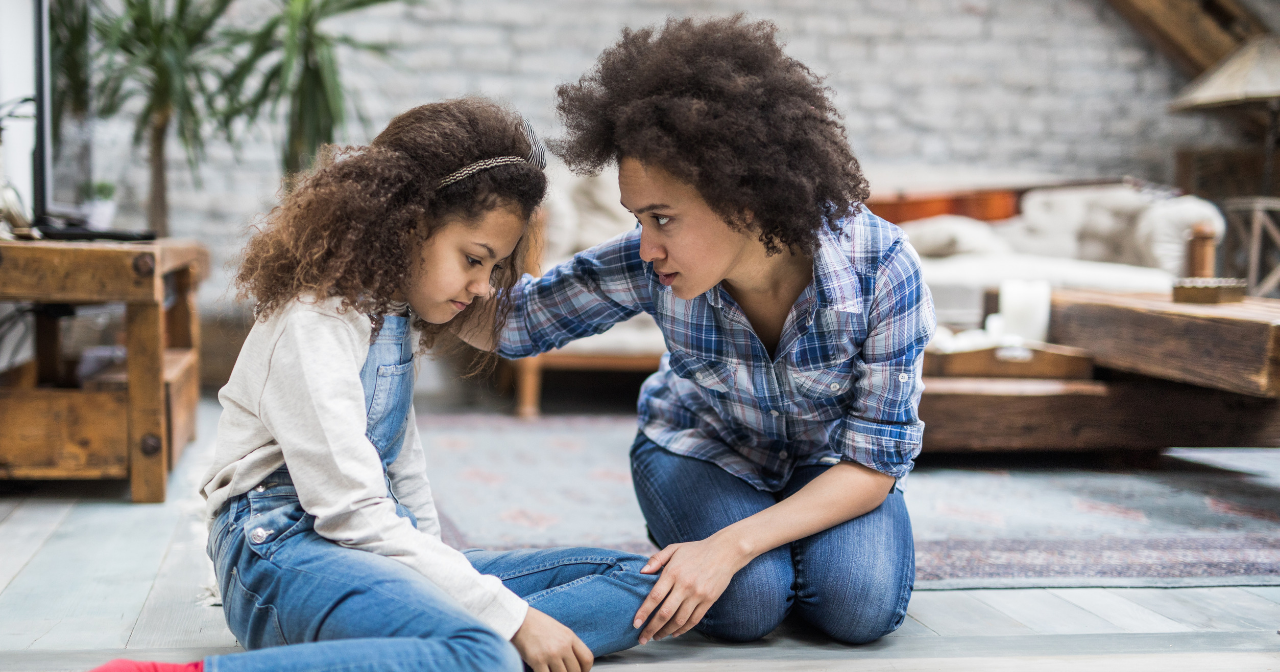 Mother talks to young daughter