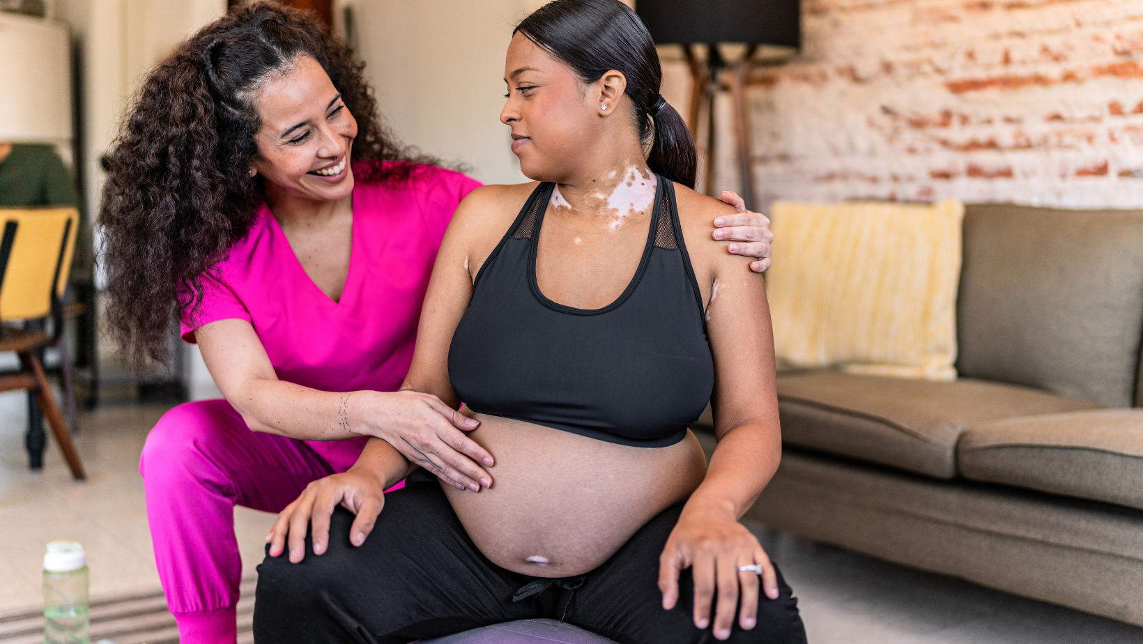 Doula assisting pregnant woman