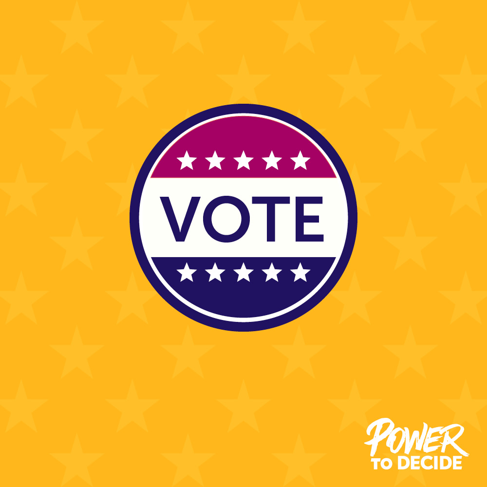 A sticker that says VOTE on a yellow backgrround