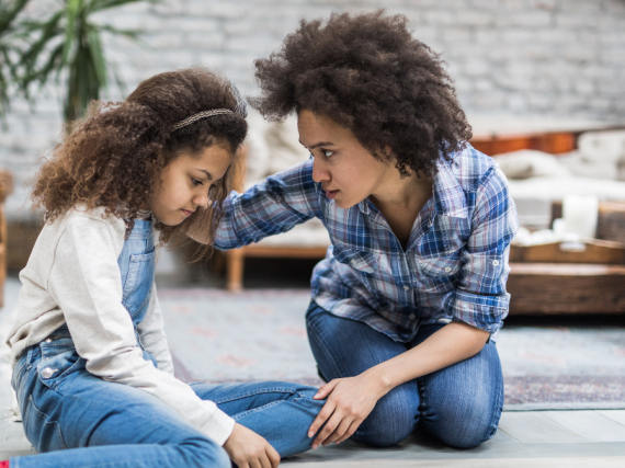Mother talks to young daughter