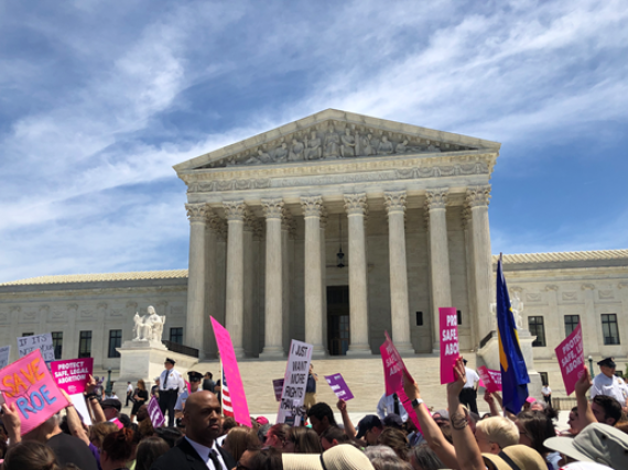 A photo of a rally for reproductive rights at the steps of the US Supreme Court. 